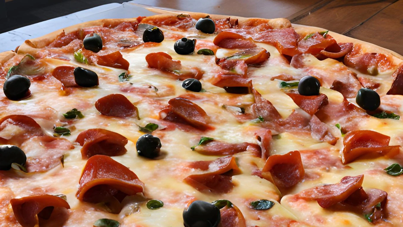 A freshly baked Chicago-style pizza with melted mozzarella cheese, pepperoni, sausage, and vegetables, served on a wooden pizza board at Pizza 9 in Farmington, New Mexico.